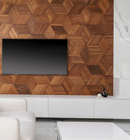 Modern TV feature wall with 3D walnut wood geometric panels in a bright living room with white cabinetry and marble accents.