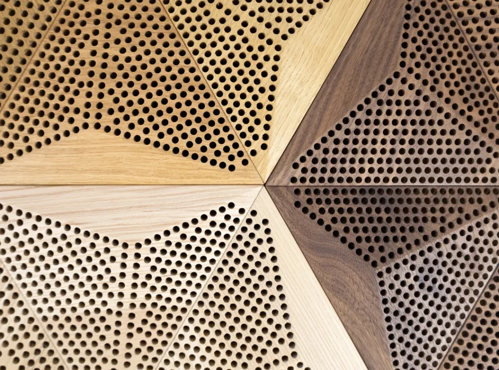 Close-up of sound dampening panel with perforated wood texture