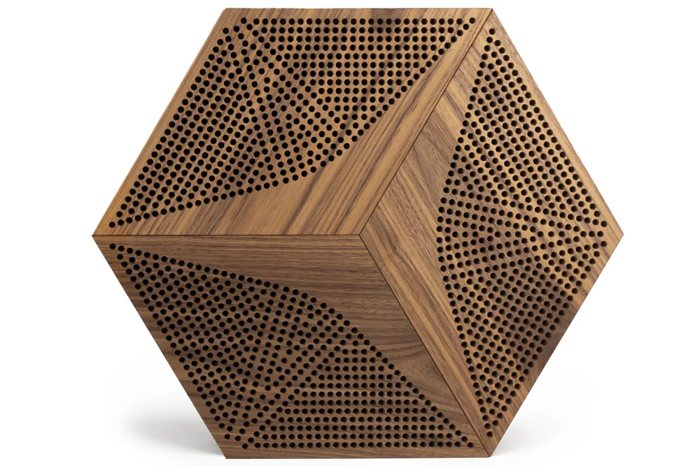 Dark acoustic wood panel in hexagonal shape for interior wall treatment