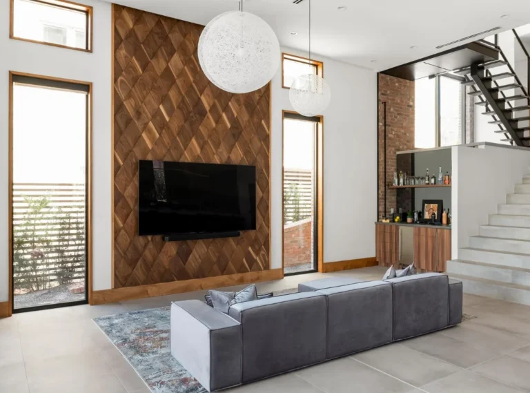 Living room with TV and accent wall made of oak wood panels