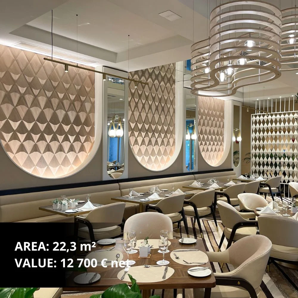 Modern living room with geometric wooden wall panel as a decorative feature behind a dining table.