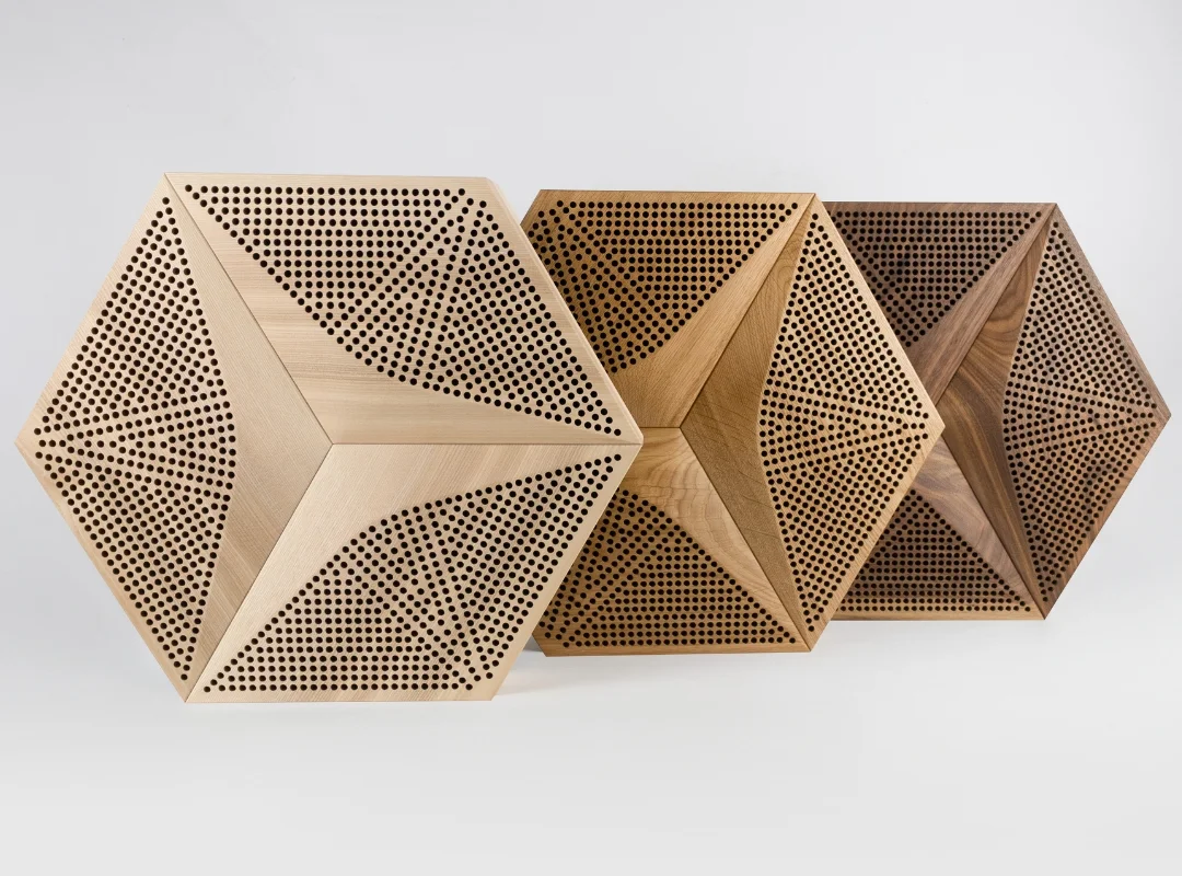Decorative acoustic panels with geometric wood design mounted on the wall