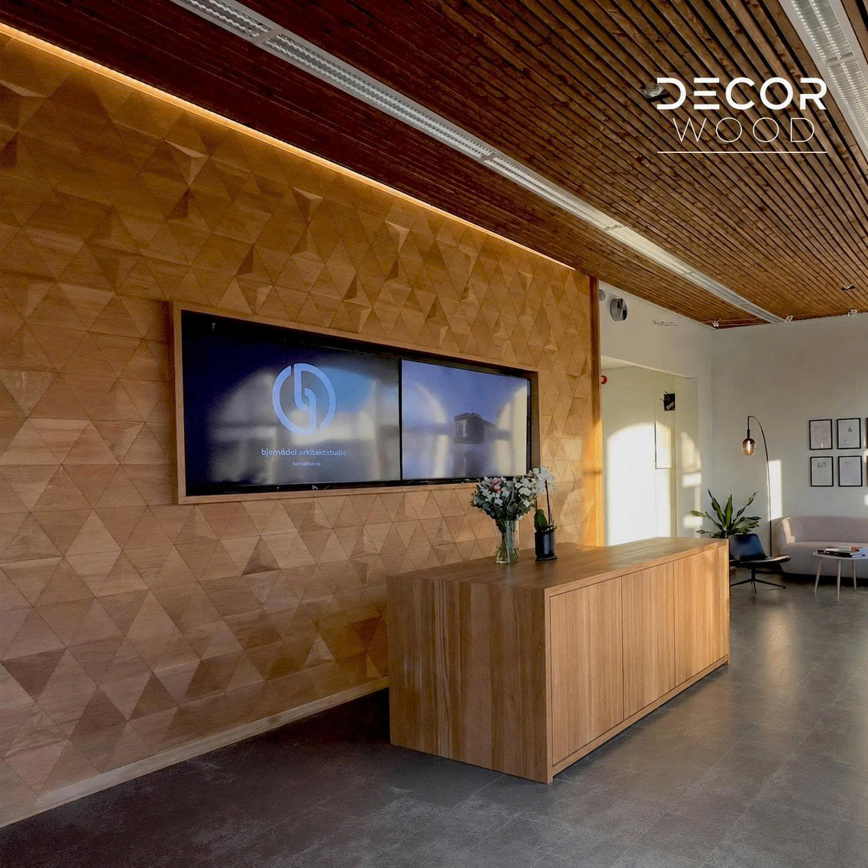 Contemporary interior featuring golden 3D wood panels on the wall, green sofa, and lush decorative plants